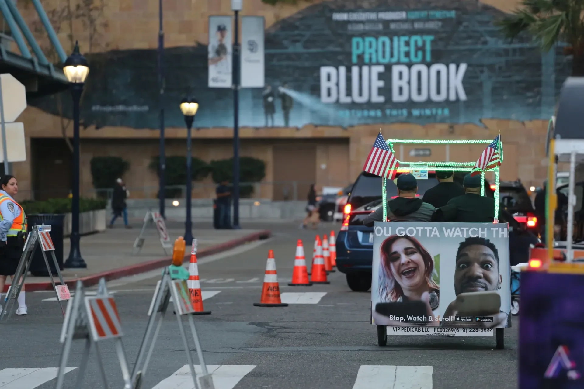 Branded pedicab night ride near convention center during Comic-Con