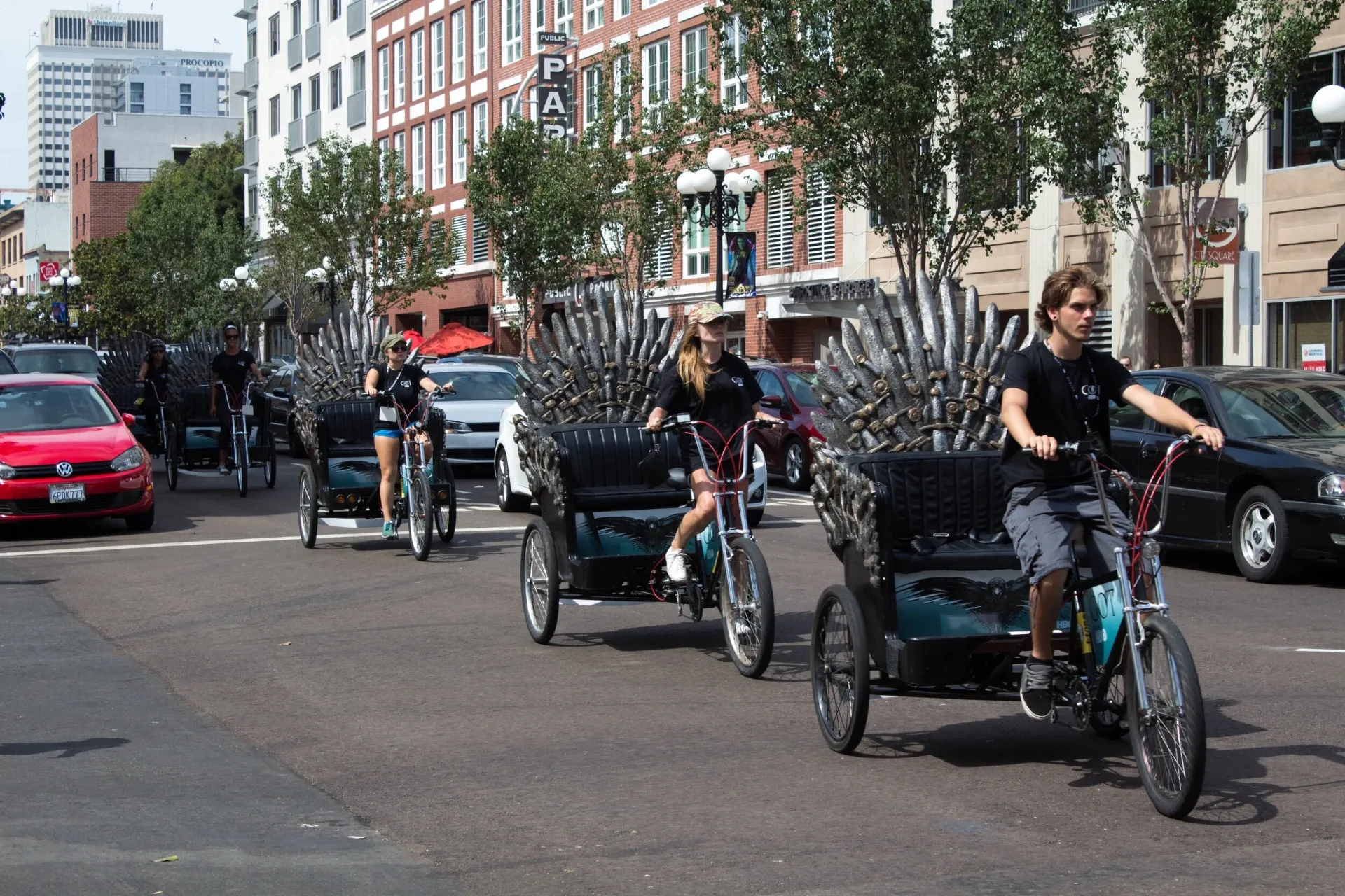 Game of Thrones Iron Throne branded pedicab fleet riding through downtown San Diego Comic-Con Gaslamp Quarter