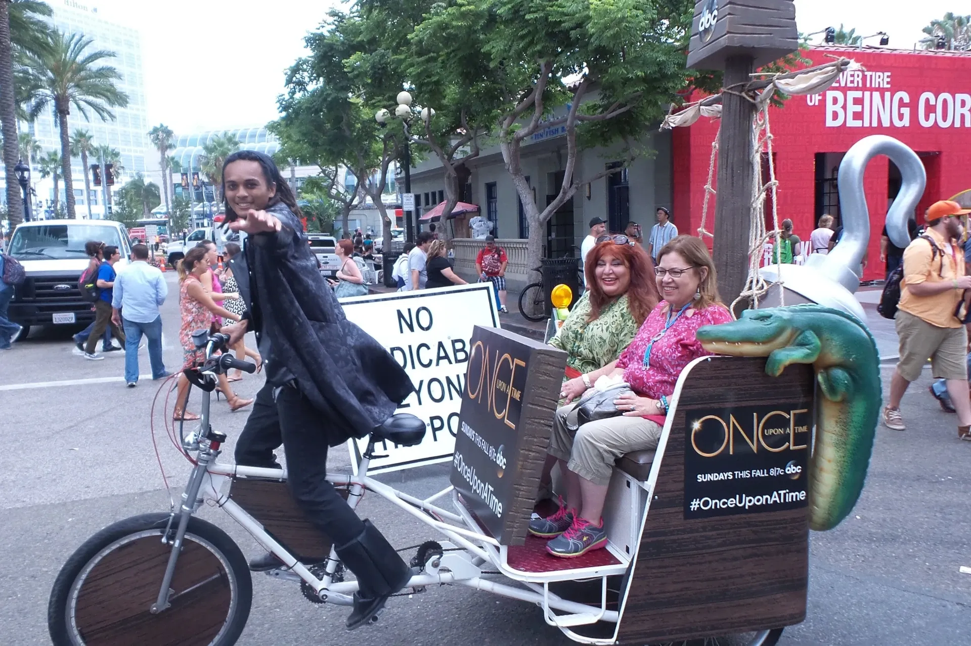 Once Upon a Time themed pedicab with happy passengers near convention center