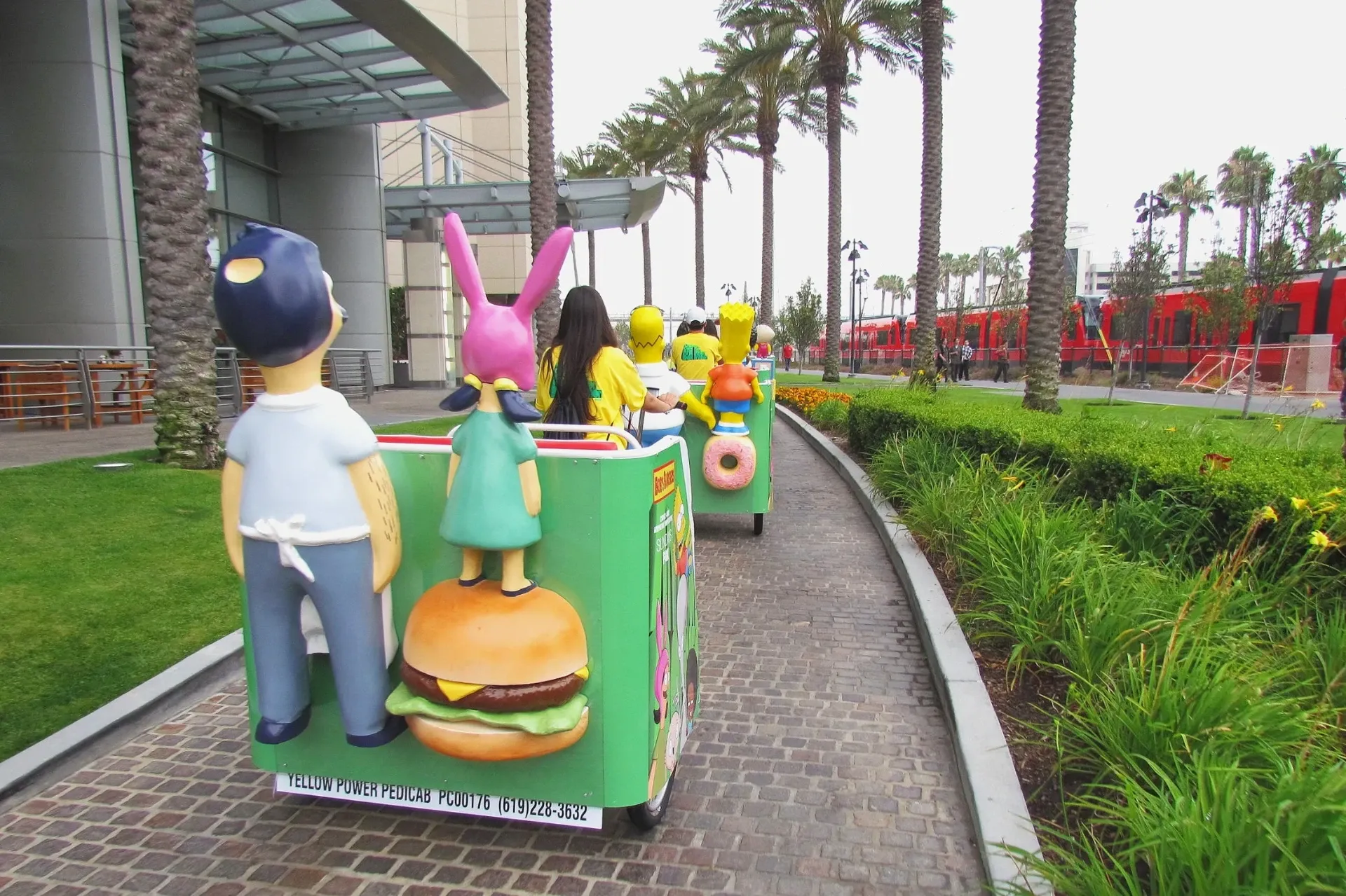 Simpsons and Bob's Burgers themed pedicab fleet at convention center Comic-Con