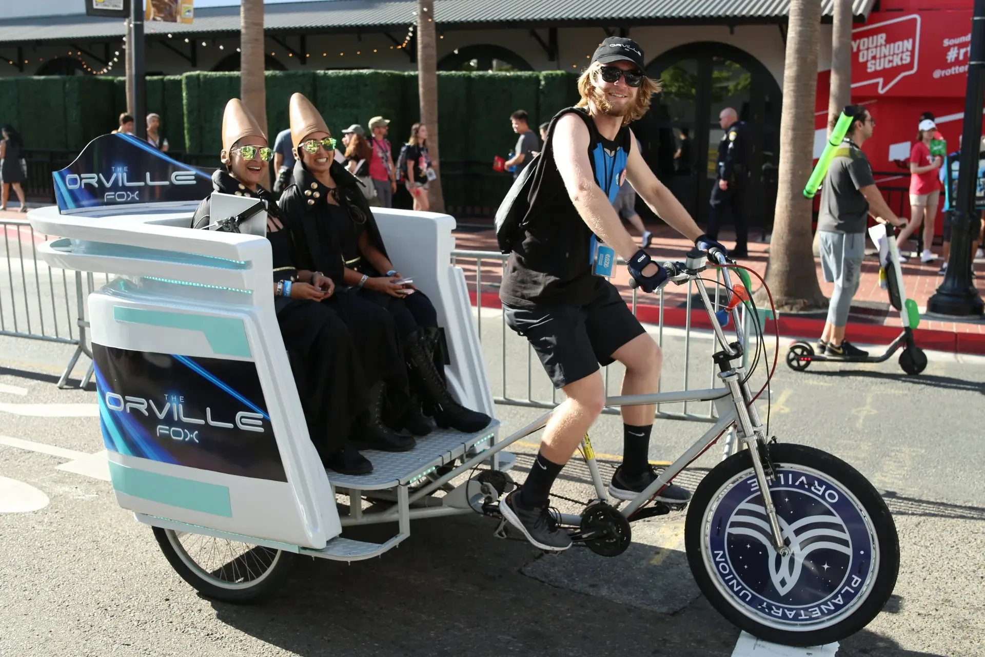 The Orville FOX branded pedicab with cosplay passengers at Comic-Con